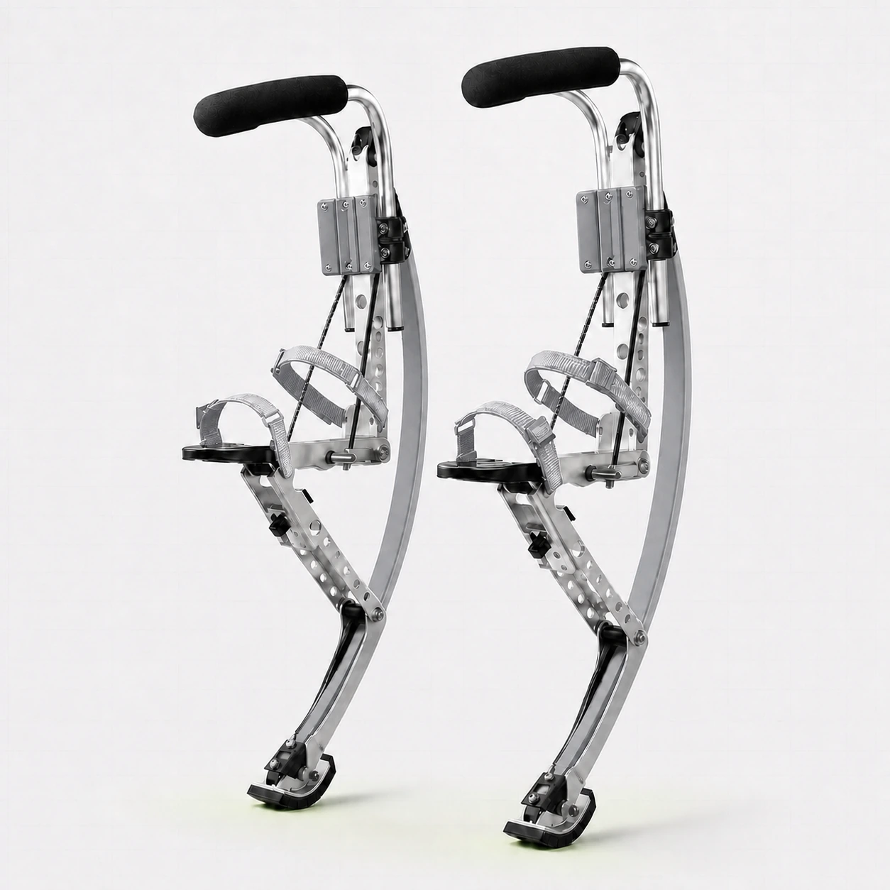 Pair of adult silver jumping stilts on a white background